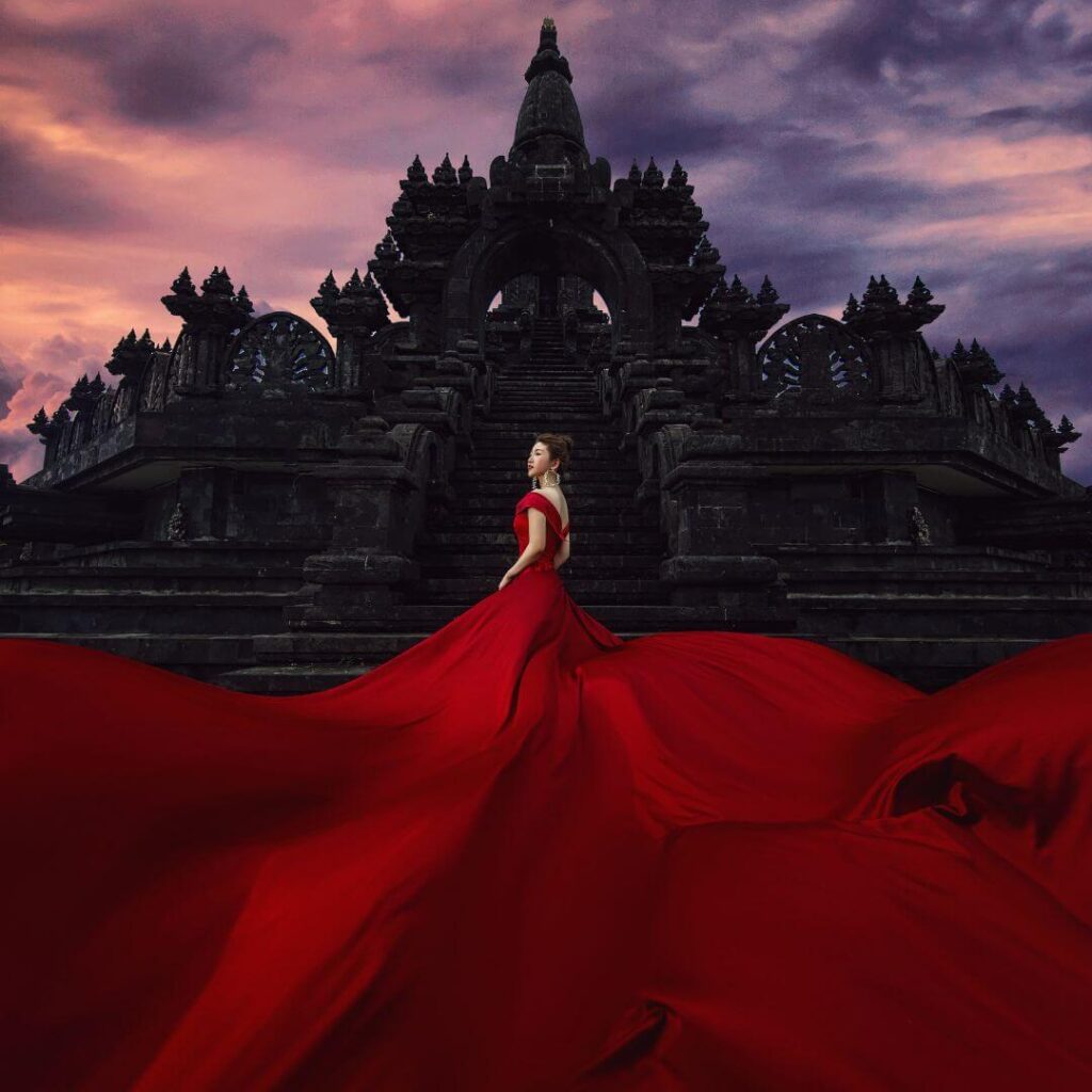 woman wearing a long red gown