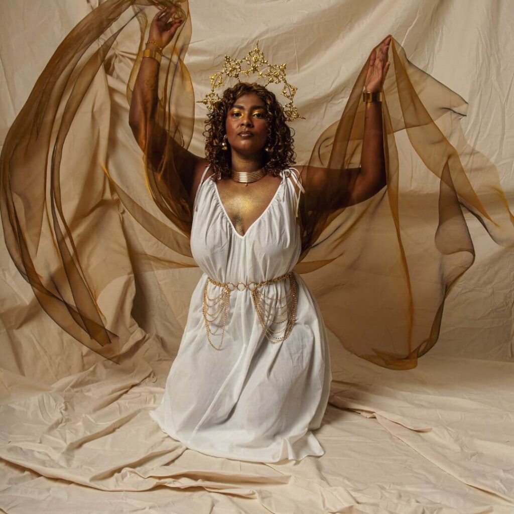woman wearing a white dress and crown